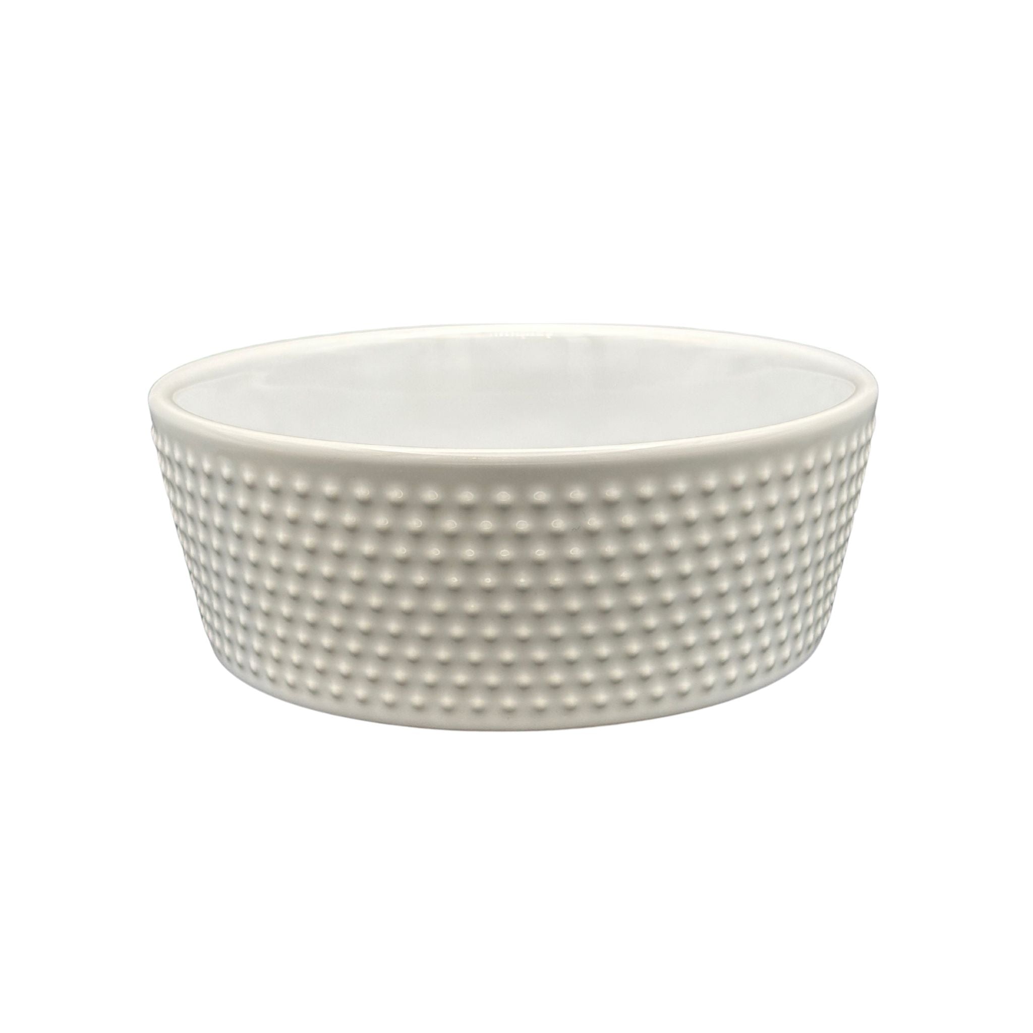 All-White Ceramic Dog Bowl with ridged surface and heavy base. Side of Dog Bowl.