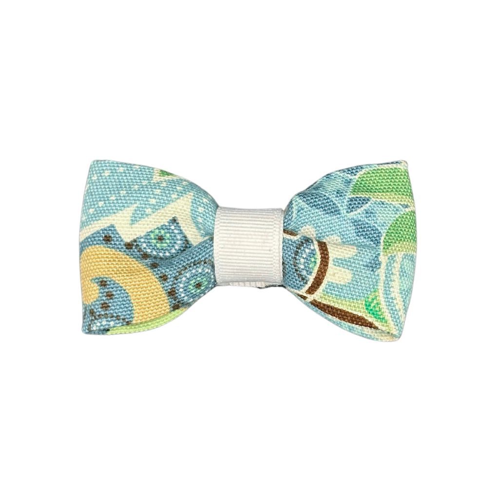 Aqua blue mosaic print dog collar bow with green and tan accents, handcrafted pet accessory.