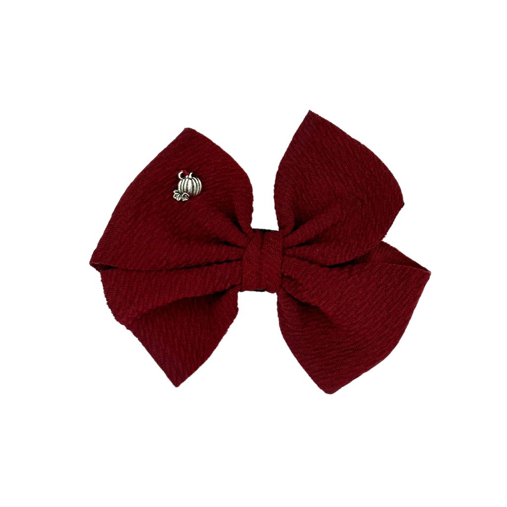 Dog Collar Bow: Burgundy Pumpkin Charm Dog Collar Bow with a decorative pumpkin charm and hand-sewn elastic straps for easy attachment.