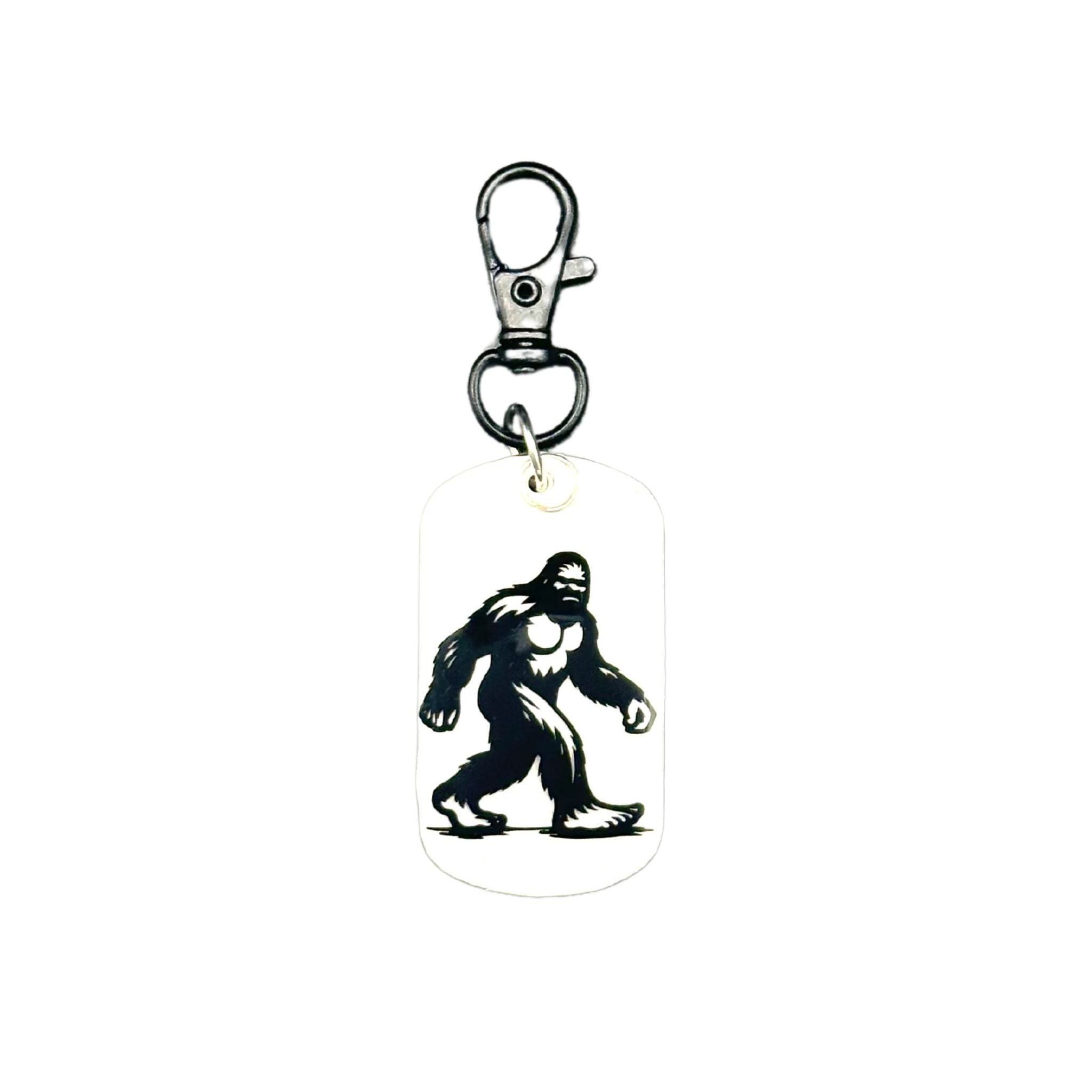 Pet ID Tag: All white pet id tag with big foot on one side and qr code on the other. All qr codes line to free pet profile.