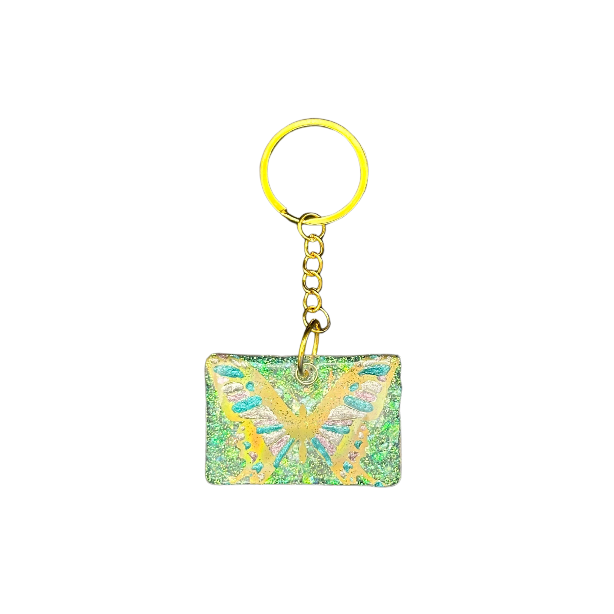 Front view of the "Butterfly Garden" resin ID tag, showcasing the clear resin with purple accents, a green background, and a butterfly design with gold outline and blue and purple wings.