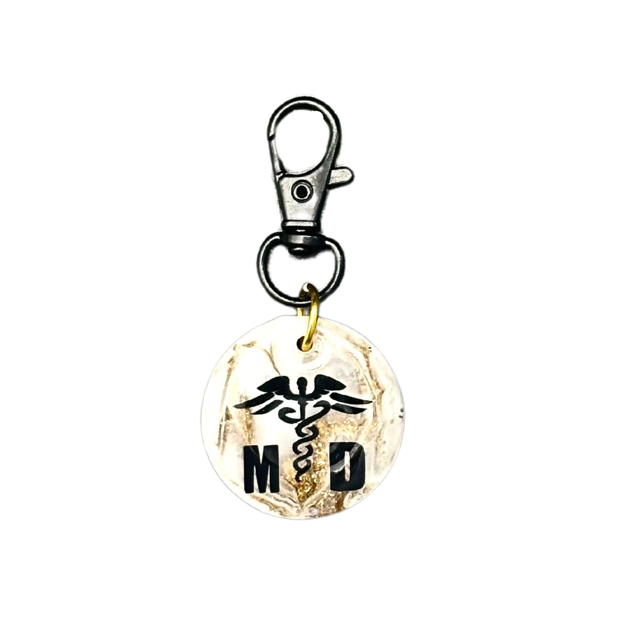 Medical ID Tag with gold glitter finish, featuring a National Medical symbol, 'M' and 'D' letters, and a scannable QR code on the back