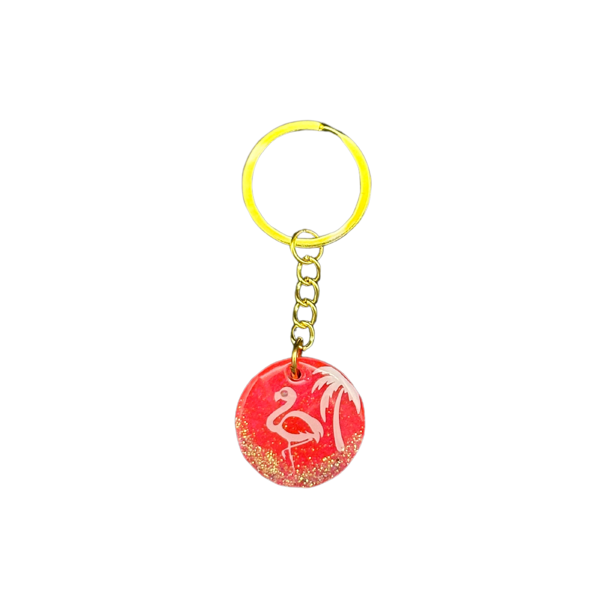 Front view of the "Tropical Paradise Pink" round resin ID tag, showcasing the hot pink background with a white palm tree and flamingo, and a glitter-coated bottom, protected by a clear resin layer.