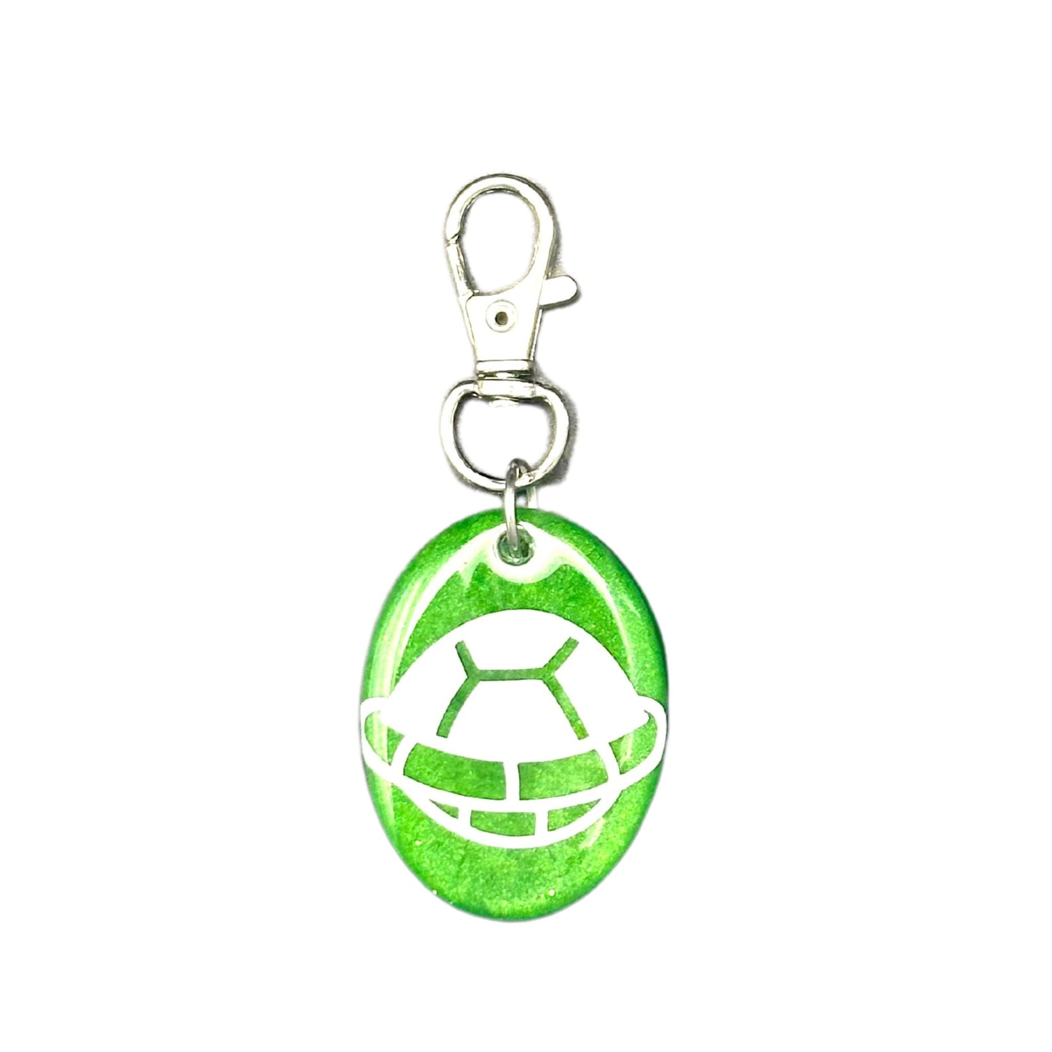 Turtle Shell Pet ID Tag with emerald green background, white turtle shell design, and a scannable QR code on the back, protected by a resin coat.