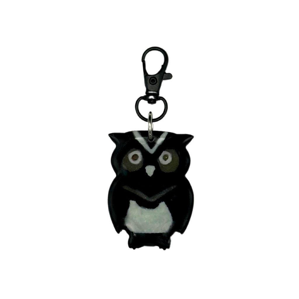 Glow-in-the-dark owl-shaped pet ID tag with customizable QR code and keychain clasp.